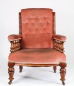 Victorian mahogany armchair, the button upholstered back flanked by serpentine uprights, the