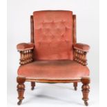 Victorian mahogany armchair, the button upholstered back flanked by serpentine uprights, the