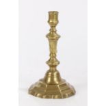 George III brass candlestick, circa 1760, the octagonal sconce above a conforming waisted stem and