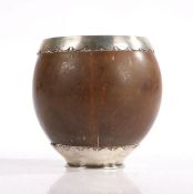 18th Century white metal mounted coconut cup, the rim and foot with repeating demi lune