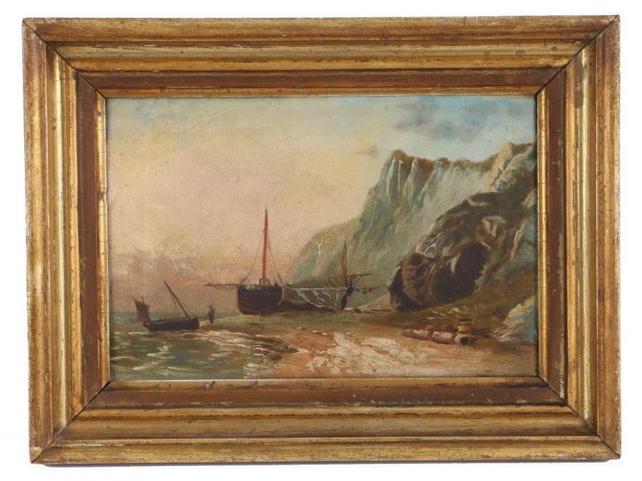 English School (19th century) Coastal scene with figure, boats and cave, unsigned, oil on canvas,