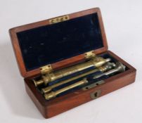 19th Century brass enema kit by Eisler, London, housed in a blue baize lined fitted mahogany case,