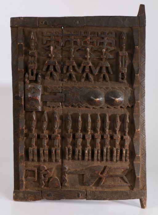 Mali Dogon 20th Century wooden door, carved with multiple figures and geometric motifs, open