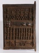 Mali Dogon 20th Century wooden door, carved with multiple figures and geometric motifs, open