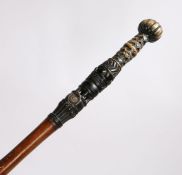 Early 20th Century Ashanti walking stick, the ebonised gadrooned terminal above a diamond and