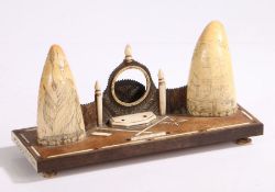 Whale tooth decorated desk stand, with central pocket watch holder flanked by two whale teeth