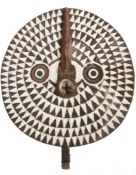 Burkina Faso Bobo or Bwa sun mask, the white field with black triangular motifs surrounding carved