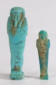Two Egyptian Ushabti figures, turquoise glazed pottery, the smaller example with hieroglyphs to