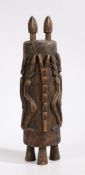 Mali Dogon small standing cupboard, the top with two surmounted heads, above two carved doors