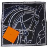 Hermes silk 'Robe du Soir' scarf, horse head design on dark blue ground, in original box, 90cm x