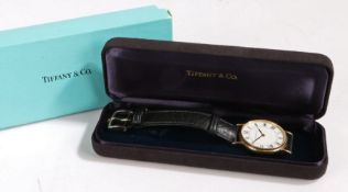 Tiffany & Co. 14 carat gold gentleman's wristwatch, the signed white dial with Roman numerals and