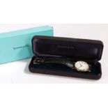 Tiffany & Co. 14 carat gold gentleman's wristwatch, the signed white dial with Roman numerals and