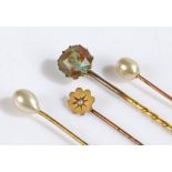 9 carat gold and pearl stick pin, three other stick pins, the largest 7.5cm long (4)