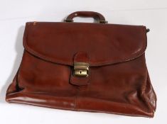 A Gianni Conti tan leather attache case, stamped, fully lined, a/f