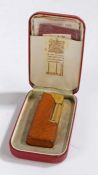 Dunhill "Rollagas" gilt metal pocket lighter, with engine turned effect exterior and brown leather