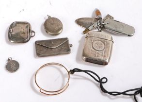 Silver vesta case hung with various fobs including a Joh. Engstrom miniature folding penknife,