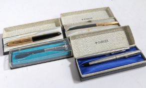 Two Parker fountain pens, both with rolled gold lids, boxed; together with three other Parker