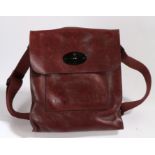 A Mulberry dark claret leather satchel bag, flap with postman's lock, with webbing shoulder strap,