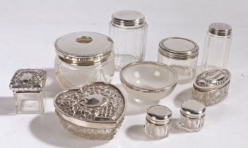 Collection of ten silver lidded and rimmed glass dressing table pots and bowls, to include a