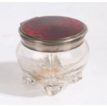 Continental white metal and enamel dressing table pot, the hinged circular lid with red enamel