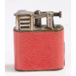 Dunhill "Sports" pocket lighter, the striker with hinged cover above a red leather body, patent