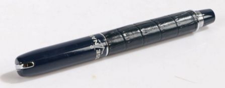 Ulysse Nardin ballpoint pen, the blue cap above a blue leather body, with company emblem to foot