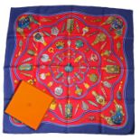 Hermes "Qu importe le flacon..." silk scarf, the blue and red ground decorated with polychrome