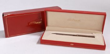 An S.T. Dupont ballpoint pen, of ribbed design, with documentation, boxed