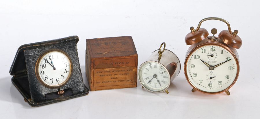 Ansonia 'Bee' travel timepiece, housed in original box, together with a Peter alarm clock and a