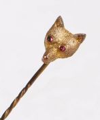 9 carat gold fox head stick pin, with two garnet set eyes, on a twist effect pin, 5cm long, 0.9g