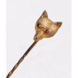 9 carat gold fox head stick pin, with two garnet set eyes, on a twist effect pin, 5cm long, 0.9g