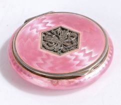 Continental silver and puce enamel powder compact, of circular form, the engine turned hinged lid