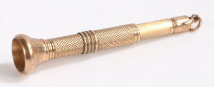 9 carat gold cigar piercer, the engine turned body with flared terminal and sprung mechanism, 8cm