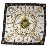 Hermes "Les Cles" silk scarf, the white ground with central depiction of a purse, silk cords and