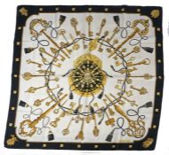 Hermes "Les Cles" silk scarf, the white ground with central depiction of a purse, silk cords and