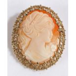 A cameo brooch in 9 carat yellow gold foliate scroll mount