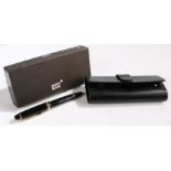 Montblanc Meisterstuck Traveller fountain pen, the polished black body with gilt mounts, 14 carat