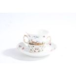 Berlin porcelain chocolate cup and saucer, circa 1770, the cup with pierced gilt double scroll