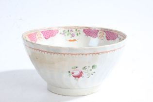 George III pearlware slop bowl, the body with a wavy ribbed design decorated with a pink and