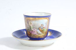 Sevres porcelain cup and saucer, painted with a scene of a young couple within a gilt cartouche on a