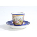 Sevres porcelain cup and saucer, painted with a scene of a young couple within a gilt cartouche on a
