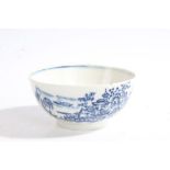 A porcelain bowl, POSSIBLY ISLEWORTH, CIRCA 1775-85 printed in blue with a Chinese landscape