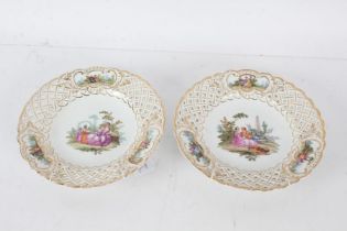 Pair of Meissen porcelain cabinet plates, the first painted with a courting couple, the second