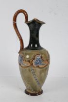 Royal Doulton stoneware ewer, the baluster shaped ewer with long slender neck in dark green glaze,