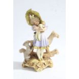 Austrian Turn Wein porcelain figure group, depicting a young girl holding a toy with a dog and a