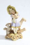 Austrian Turn Wein porcelain figure group, depicting a young girl holding a toy with a dog and a