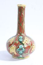 Della Robbia pottery vase c1894-1906, with a slender neck and a bulbous body, decorated with vines