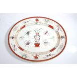 Large 19th century Minton oval meat plate, decorated with a chinoiserie design in red and white,