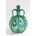 An early 20th century green glass wine bottle, with polychrome hand painted designs depicting grapes