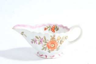 A Bow porcelain creamer, circa 1765, polychrome decorated with sprigs of flowers, 11cm long  MB